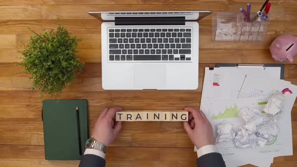 Word Training is Collected From Wooden Cubes on a Desktop Desk