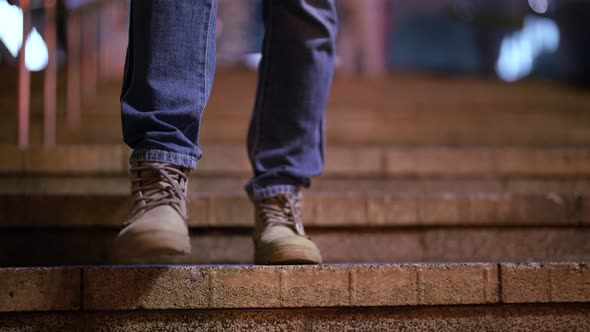 Casually Dressed Woman is Walking in City in Evening or Night Closeup of Feet on Stairs