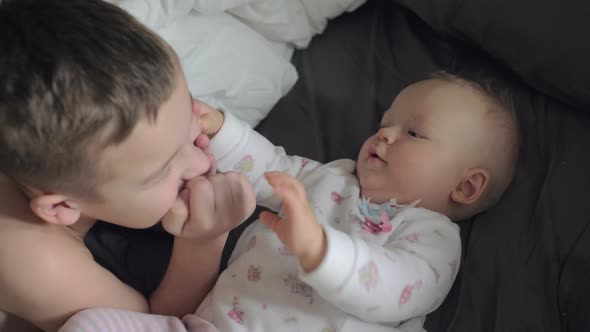 Happy Young Boy with His Baby Sister Caucasian