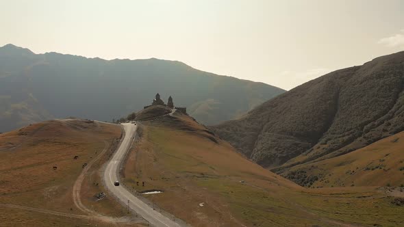 Black Car Approaching Gergeti Trinity Monastery