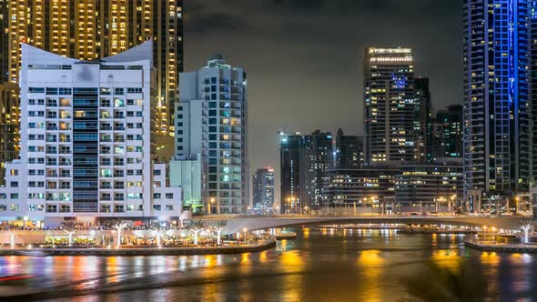 View of Dubai Marina Towers and Canal in Dubai Night Timelapse