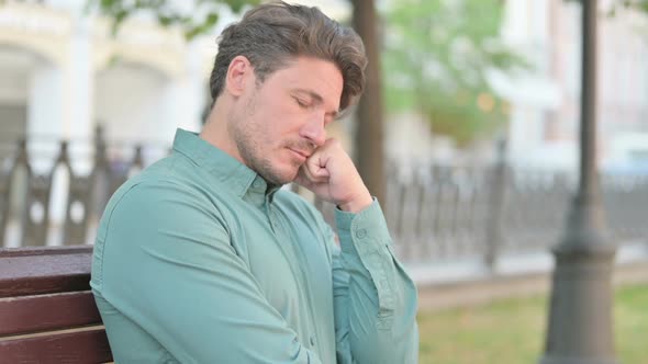 Portrait of Man Taking Nap on Bench