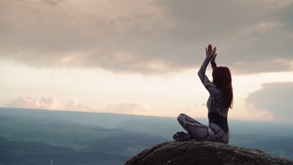 Girl Practices Yoga While Sitting in Lotus Position Beautiful Mountain Landscape
