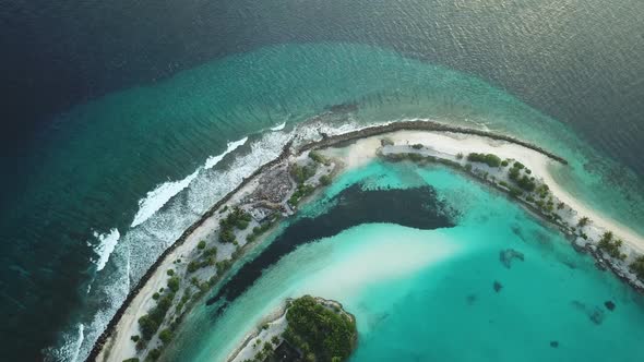 Aerial Drone View of a Beautiful Atoll or Island with a Resort in the Maldives