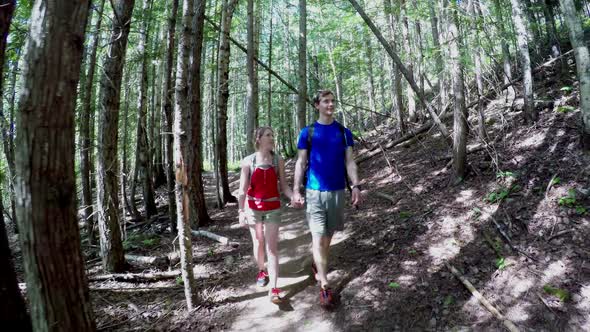 Couple walking in the forest 4k