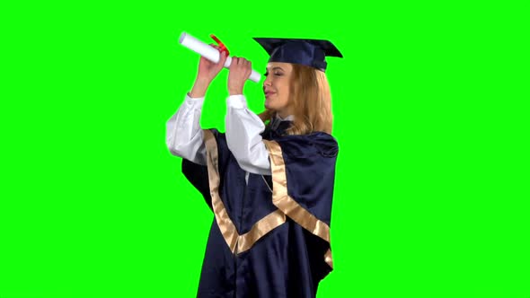 Woman Graduate in Gown with Diploma. Green Screen. Slow Motion