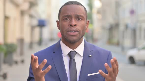 Outdoor African Businessman Feeling Shocked Upset