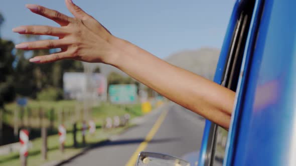 Young woman on a road trip in pick-up truck