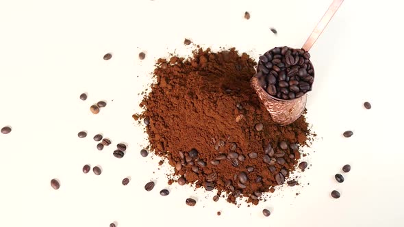 Coffee powder and roasted coffee beans on white background. Turk with coffee beans.