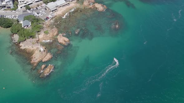 Vertical aerial shows the clear green water of lagoon at Knysna Heads