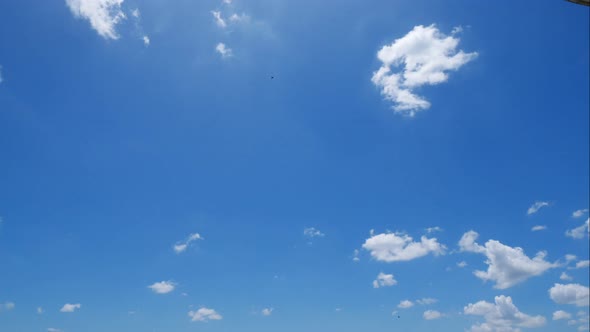 Time lapse of white cloud moving pass around sky background