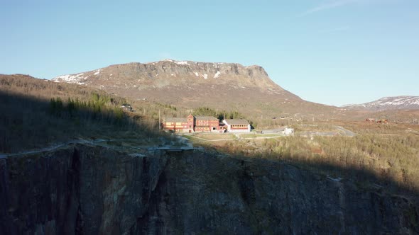 Spectacular hotel located on edge of cliff Vøringsfossen Hardangervidda national park - Sunset rever