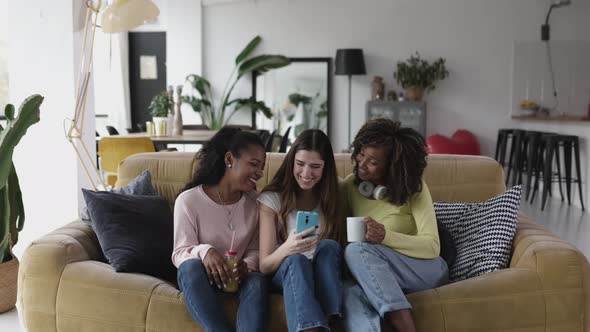 Cheerful Multiracial Female Friends Enjoying Free Time Together at Home