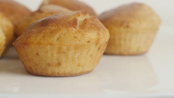 Slow tilt on muffin cornmeal close-up 4K 2160p 30fps UltraHD footage - Cornbread baked and arranged 