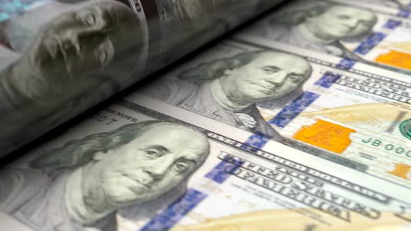Extreme Close Up of US Dollars Press Machine Printing 100 USD Banknotes