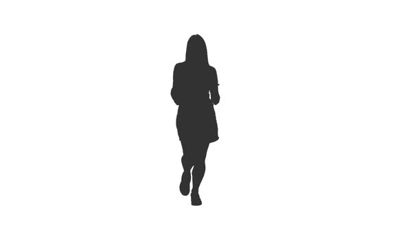 Silhouette of Young Woman With Long Hair Jogging on Street alt