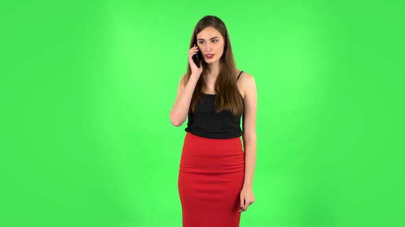 Girl Talking for Mobile Phone, Very Shocked. Green Screen