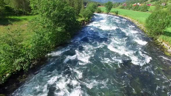 Flying above fast river in Norway