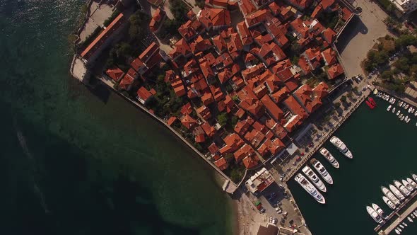 Boats are Moored to the Pier of the Old Town of Budva