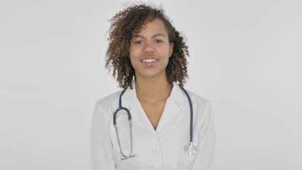 African Female Doctor Shaking Head As Yes Sign on White Background