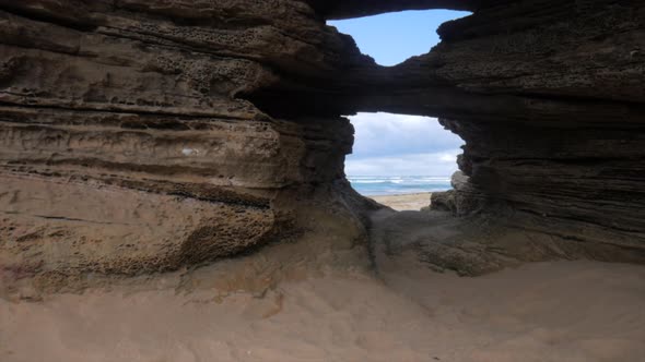 Eroded rock formation at an Australian beach. Erosion has caused two holes to be formed.