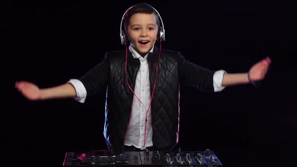 Boy Dj in Glasses Playing Music. Black Background, Slow Motion