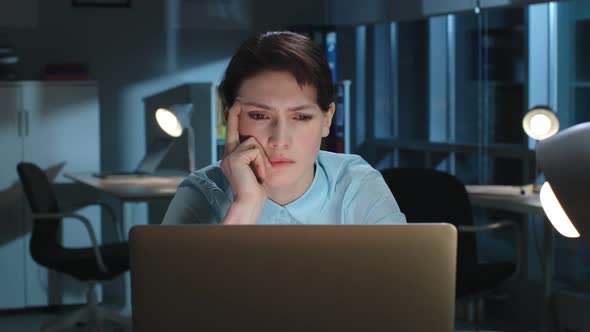 Portrait of Tired Pensive Manager Look at Laptop Screen Working Late in Headquarters