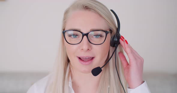 Businesswoman Using Headset In Office