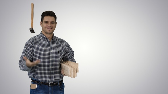 Brunette man builder with planks is ready to build something