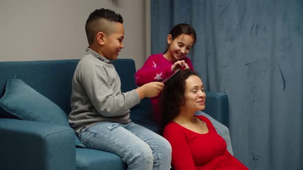 Loving Mom Relaxing Enjoying Time Spending with Diverse Kids at Home