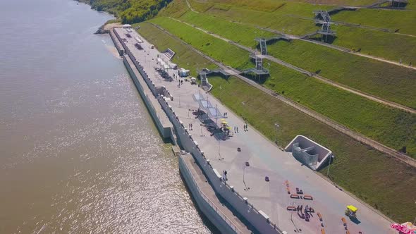 Couple Walks Along Waterfront Near Cascade Hill Aerial View