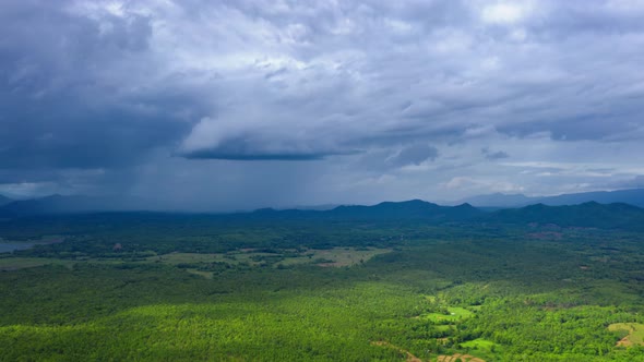 Rain storms and black clouds moving over the mountains.