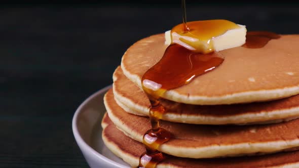 Pancake stack with butter and maple syrup