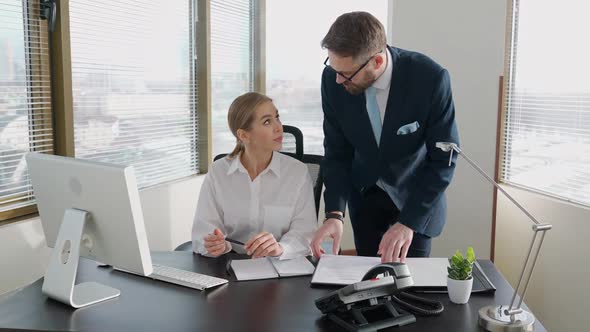 Woman Top Manager Accepts Paper Documents From a Colleague and Discusses Financial Documents White