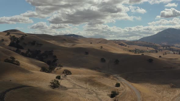 Aerial shot of California countryside with hills with perfect blue skies and clouds, Concord CA