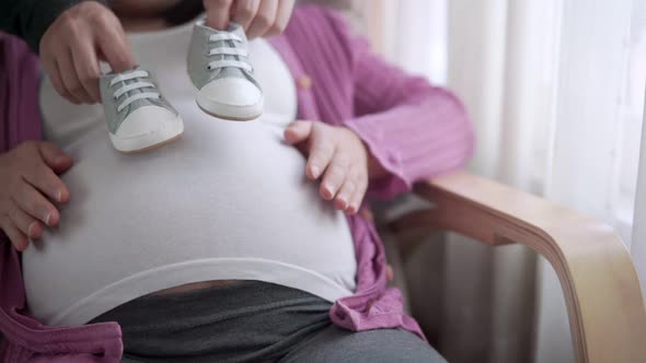 Pregnant Couple Feels Love and Relax at Home