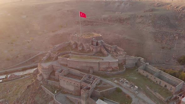 Flying Around of the Turkish Flag Over the Castle of Kars in Turkey
