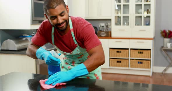 Man cleaning the kitchen worktop 4k