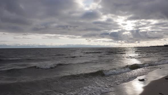 Sea Coast Waves on the Sandy Beach Sunset on the Sea Cloudy Weather