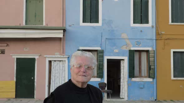 Senior Italian woman in the street of Burano