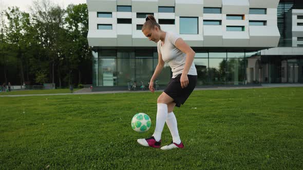 Portrait of Woman Football Soccer Player in Full Growth in the Park