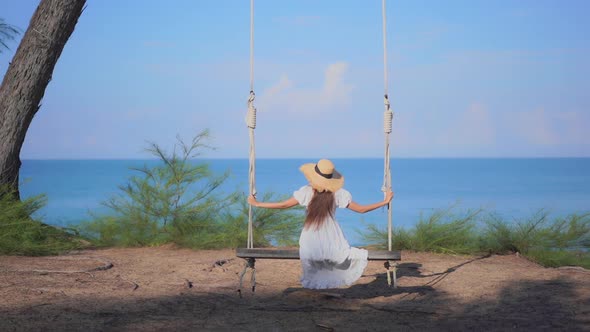 Asian woman enjoy around beautiful beach sea ocean