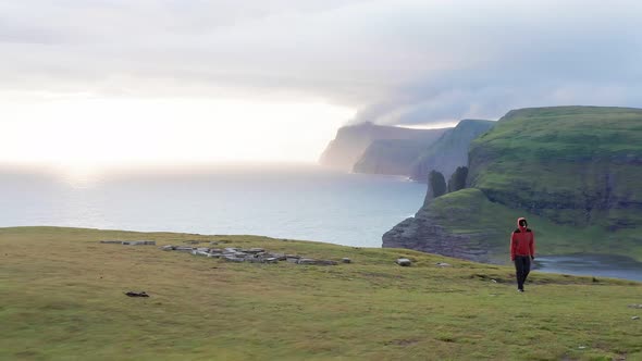 Aerial View of Man Resting After Walking Looking Coast Landscape