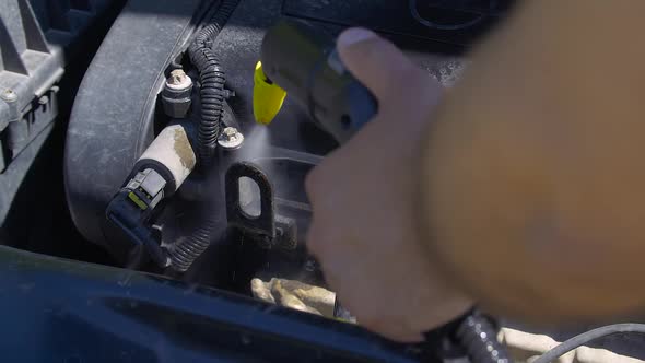 Cleaning Car Engine with Steam