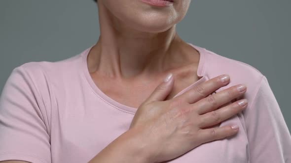 Female Hardly Breathing Holding Hand on Chest, Risk of Heart Attack, Pain