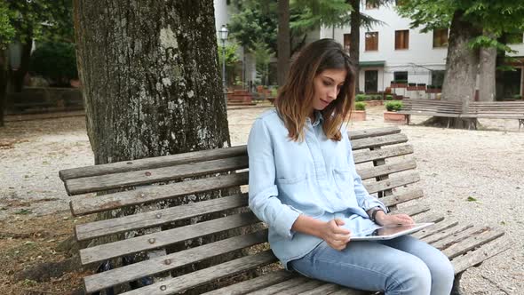 Young Woman Using Digital Tablet Outdoor