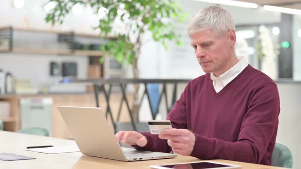 Businessman Having Online Payment Failure on Laptop