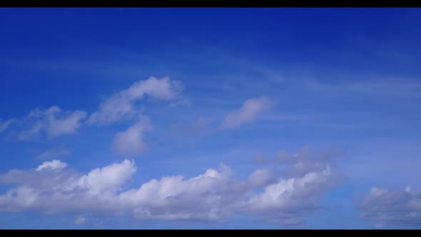 Aerial drone view abstract of tropical coastline beach vacation by shallow water with white sandy ba