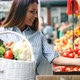 Picture of Woman at Marketplace Buying Vegetables - VideoHive Item for Sale