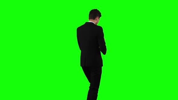 Businessman Is Going To Work and Prints Important Messages. Green Screen